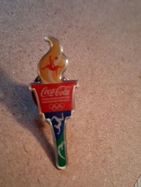 Coca-Cola Multicolor Olympic Torch Enamel Pin - Red, Yellow, Blue, Green